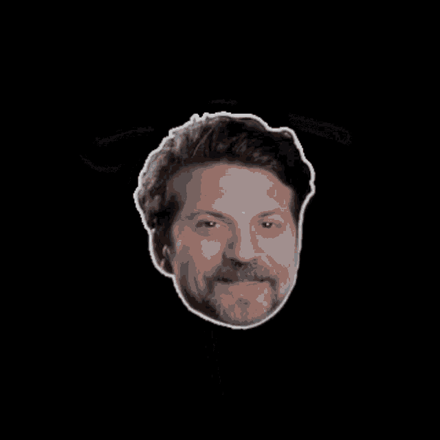 a man with a beard and a tesla logo behind him
