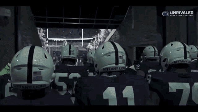a group of football players wearing helmets with the number 11 on them