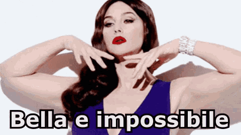 a woman in a blue dress is making a funny face with the words bella e impossibile written on the bottom