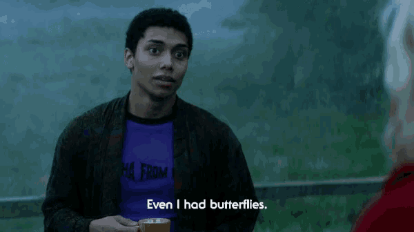 a man in a purple shirt that says " even i had butterflies " on it