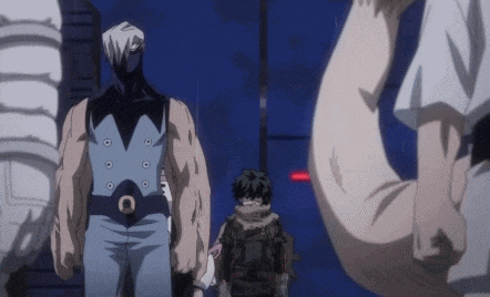 a group of anime characters are standing next to each other .