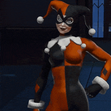 a woman in a harley quinn costume is smiling