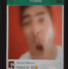 a blurry picture of a man 's face is on a cell phone screen ..