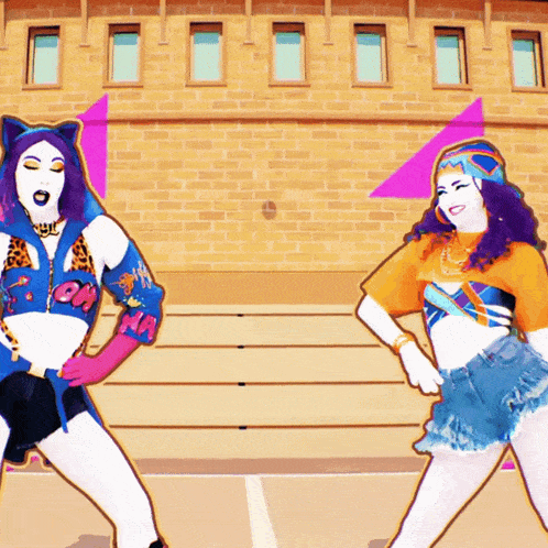 two women are dancing in front of a brick building and one of them has the letter a on her top
