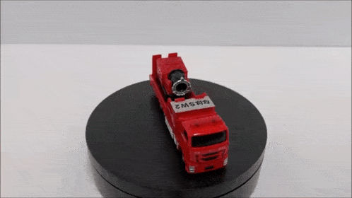 a red toy fire truck with the letters emsw3 on it