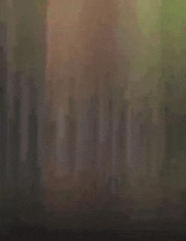 a blurry picture of a man 's face with glasses