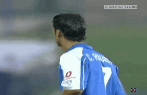 a man in a blue jersey with the number 7 on the back