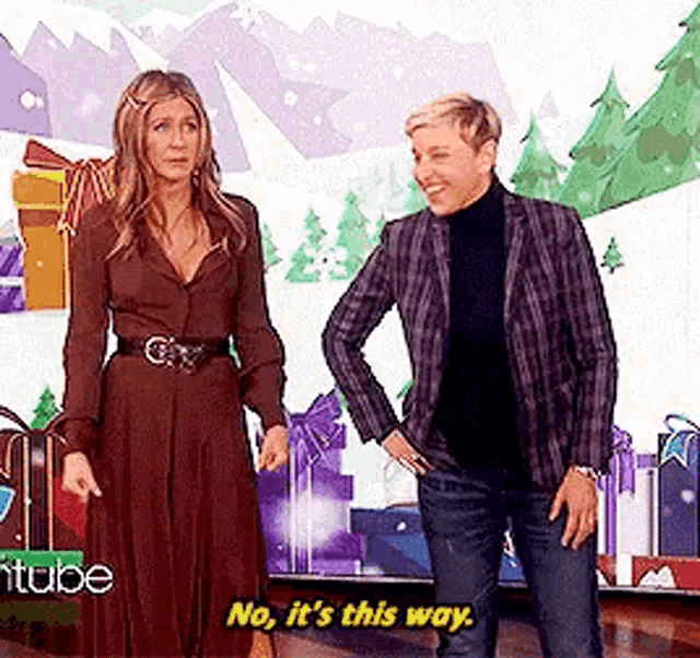 a man and a woman are standing next to each other .