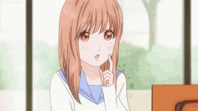 a girl with brown hair and a blue sailor uniform has her finger to her chin
