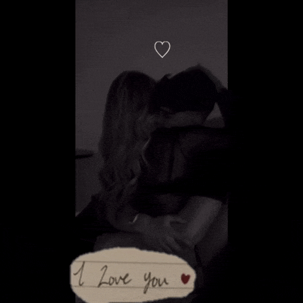 a black and white photo of a man and woman hugging with the words " i love you " written on the bottom