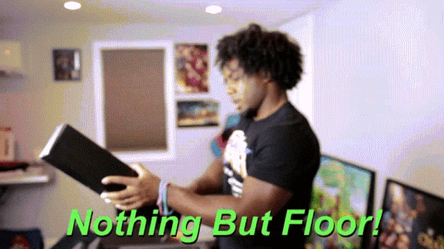 a man holding a book with the words nothing but floor written above him