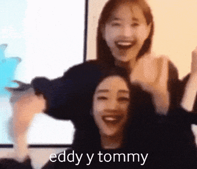 a couple of women standing next to each other with the words eddy y tommy written on the bottom
