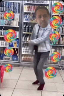 a man is dancing in a convenience store with lollipops in the background