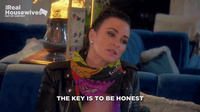 a woman sitting on a couch with the words " the key is to be honest "