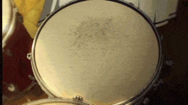 a close up of a drum with a few small spots on it