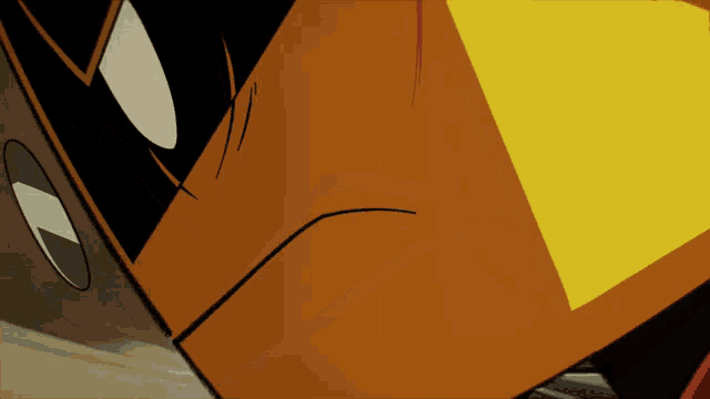 a close up of a cartoon character 's face with a yellow triangle on it
