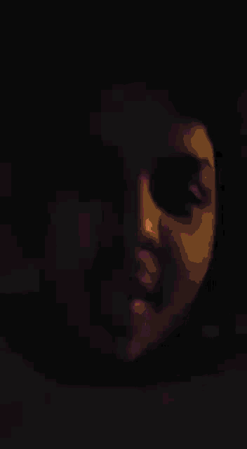 a close up of a person 's face with pink hearts floating around it .