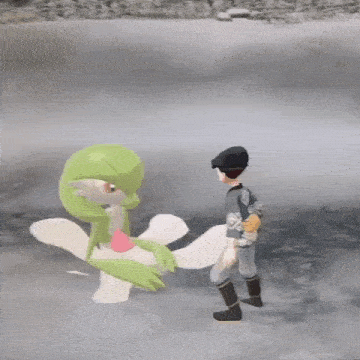 a man is standing next to a green and white cartoon character .