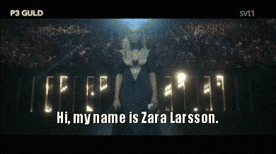 a man stands in front of a crowd and says hi my name is zara larsson