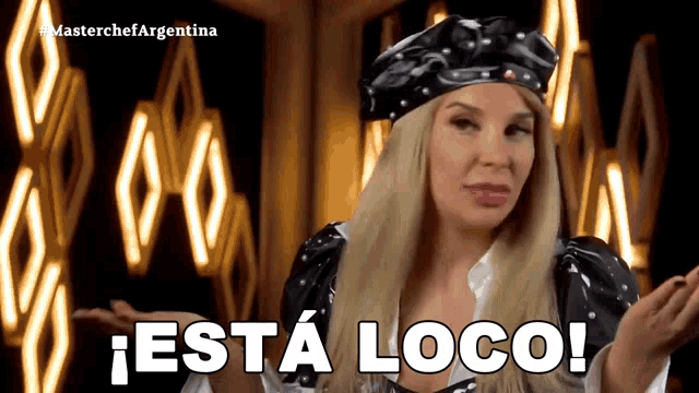 a woman in a black hat says esta loco in spanish