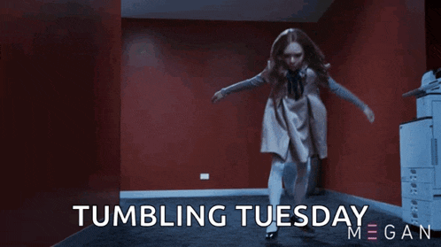 a little girl is dancing in a hallway with the words tumbling tuesday megan behind her