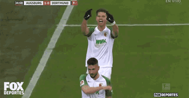 a soccer player with the number 7 on his shorts celebrates a goal