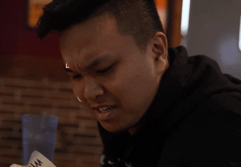 a man has a red question mark above his head
