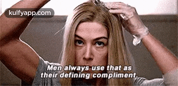 a woman is applying hair dye to her hair and says `` men always use that as their defining compliment ''