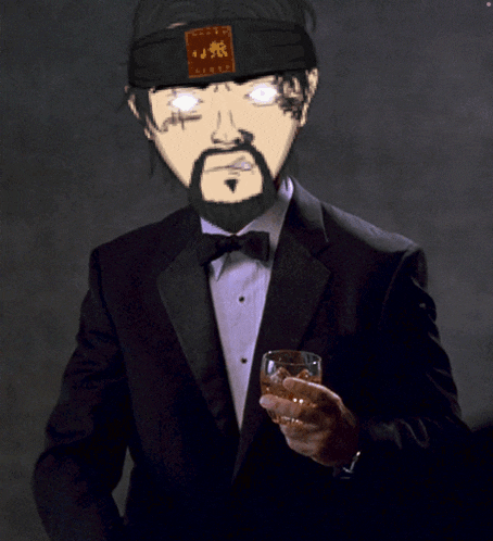 a man in a tuxedo holds a glass of alcohol
