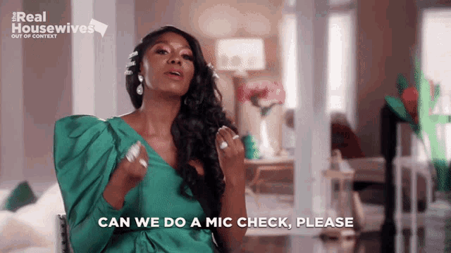 a woman says " can we do a mic check please " in front of a real housewives logo