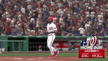 a washington nationals baseball player named james wood runs to first base