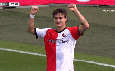 a soccer player wearing a red white and black jersey with media markt written on it