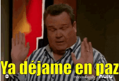 a man in a striped shirt says ya dejame en paz in spanish