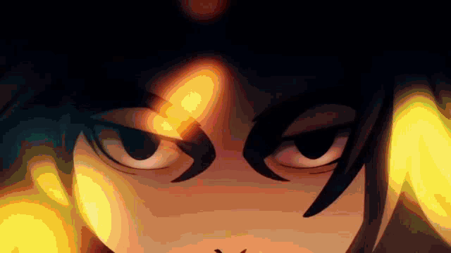 a close up of a cartoon character 's eyes with a flame coming out of them