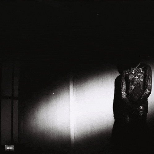 a black and white photo of a person with a hoodie that says death metal on it