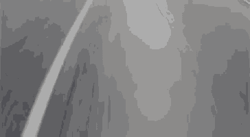 a close up of a gray object with a white stripe on the bottom .