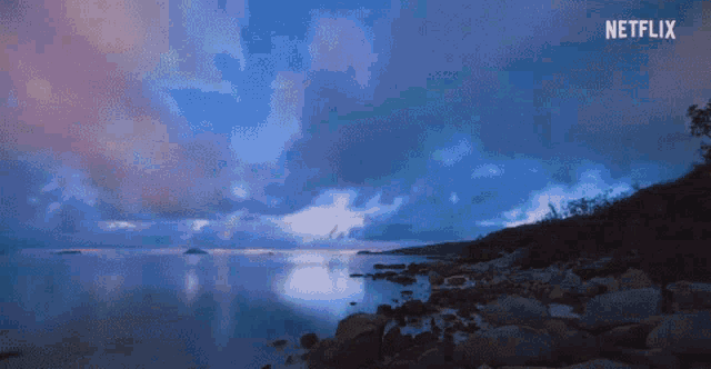 a netflix ad shows a sunset over a lake
