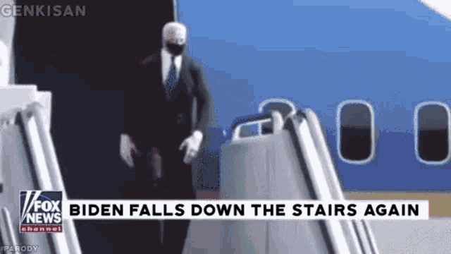 a man in a suit and tie is walking down a set of stairs next to an airplane .