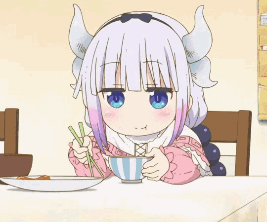 a cartoon girl with horns is sitting at a table eating food with chopsticks .