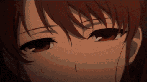 a close up of a person 's face with red hair and black eyes