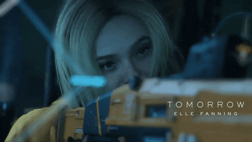 a close up of a woman 's face with the words tomorrow behind her