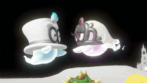 a couple of ghosts with crowns on their heads are floating in the air