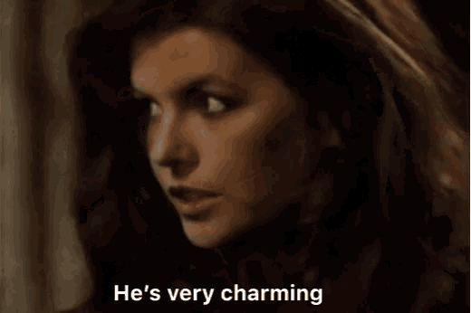 a close up of a woman 's face with the words `` he 's very charming '' written next to her .