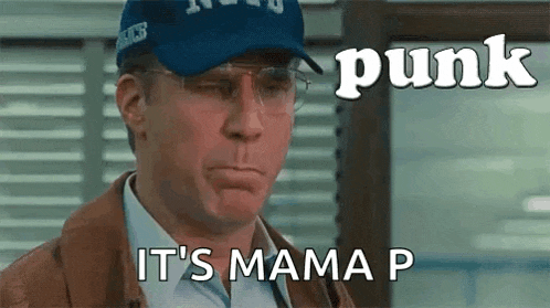 a man wearing a baseball cap and glasses is making a funny face and says `` punk it 's mama p '' .