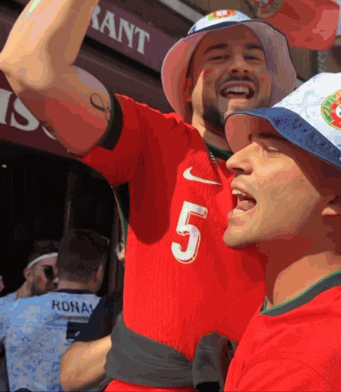 a man wearing a red shirt with the number 5