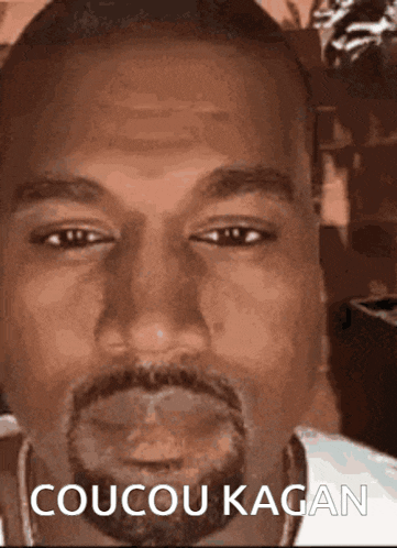 a close up of a man 's face with the words coucou kagan below him