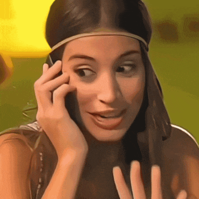 a woman wearing a headband is talking on a cellphone