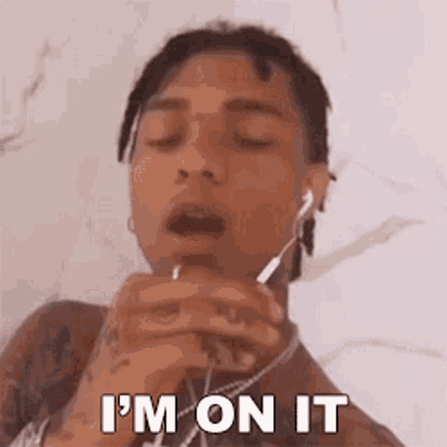 a young man wearing headphones is saying i 'm on it .