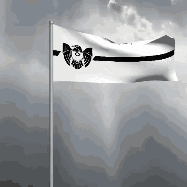 a white flag with a black eagle on it is waving in the wind