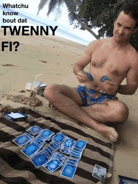 a shirtless man sits on a beach playing a game of cards with the words whatchu know bout dat twenny fi